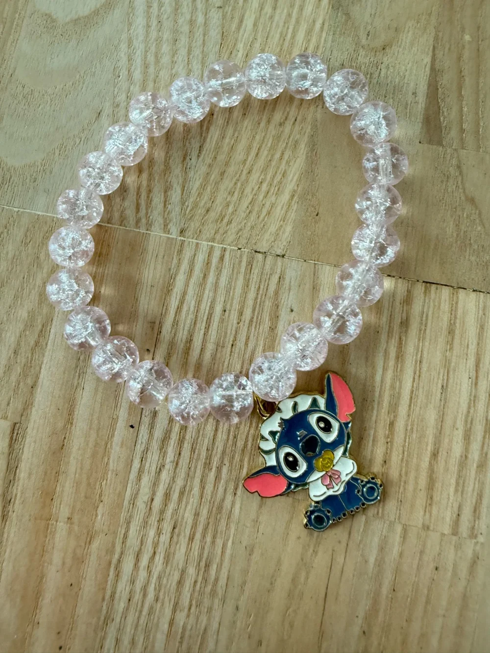 Baby Stitch from LILO & Stitch light pink crackle-glass bead stretch bracelet